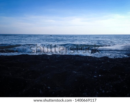 Natural Ocean Waves Sand And Beach Barrier In The Clear Blue Sky In The Morning, North Bali, Indonesia