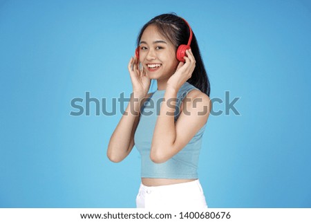 Asian young attractive beautiful young female student on blue background