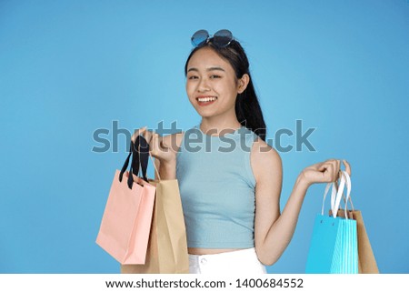 Asian young attractive beautiful young female student on blue background