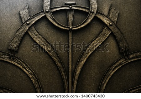Decorative forged elements of dark metal gates