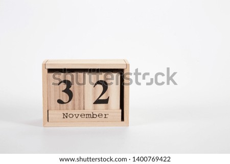Wooden calendar November 32 on a white background close up