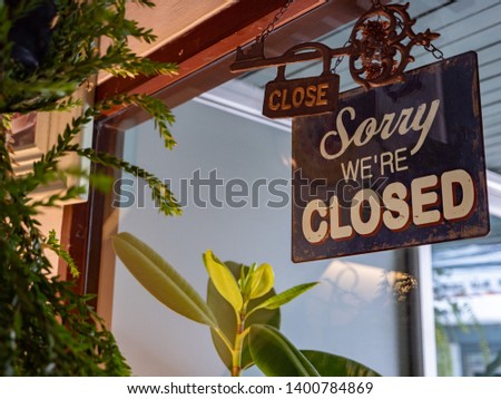 Sorry we are closed sign in cafe