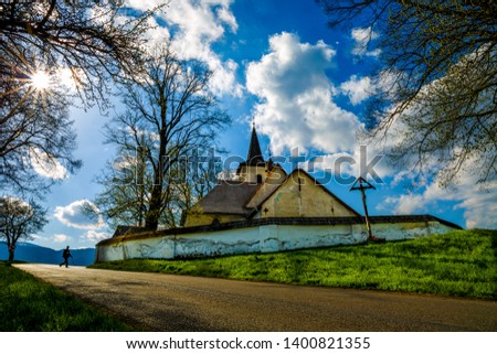 Slovakia church.clouds, sun ,path .cross 