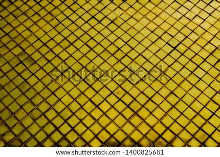 Beautiful closeup textures abstract tiles and gold color glass wall background and art wallpaper