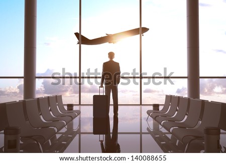 businessman in airport and airplane in sky Royalty-Free Stock Photo #140088655