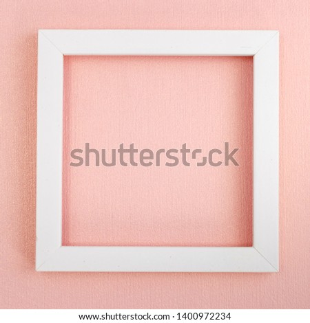 White square frame on a pink pearl design board. Background, paper texture pink color