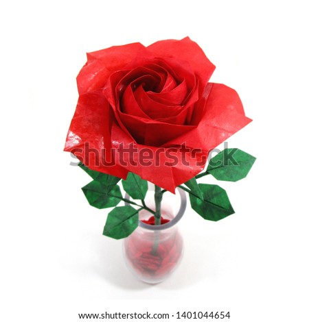 ORIGAMI PAPER RED ROSE with green leaf for love concepts of Valentine's day Holidays on White Background 