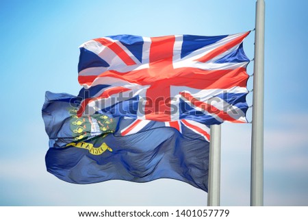 Flags of UK and the British Virgin Islands against the background of the blue sky