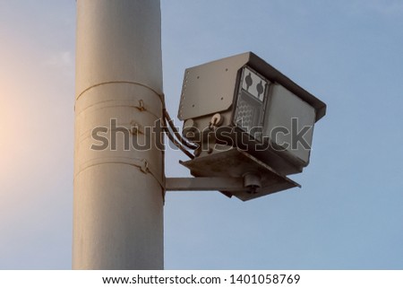 Traffic police speed radar on a pole in the city on the road. Bottom view