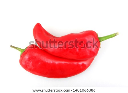 Close-Up Of Red Chili Pepper Against White Background