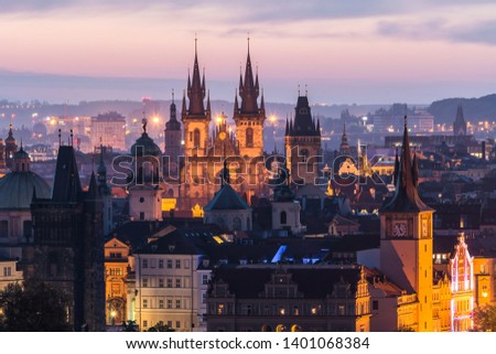 View of Prague and Charles Bridge in the early morning before sunrise. Tourism. Towers of Prague. Czech Republic