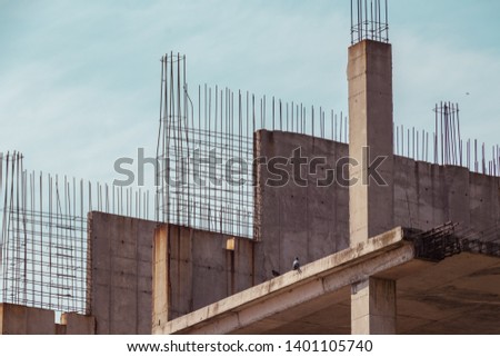 Modern construction site, concrete structure, building under construction, reinforced concrete structure. Construction site concept. Atmospheric background