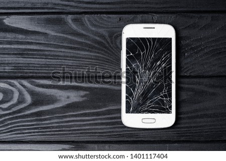 Broken phone screen. Smartphone with broken screen