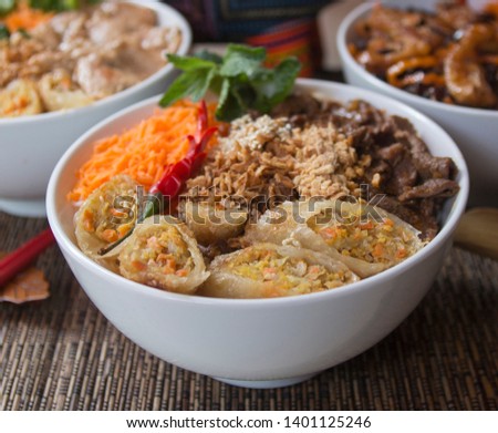 Vietnamese food: Bo Bun Beef, served with asian decoration and Vietnamese Buffalo symbol