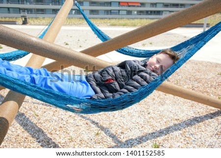 boy resting in a hammock