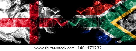 English vs South Africa, African smoky mystic flags placed side by side. Thick colored silky smokes flag of England and South Africa, African.