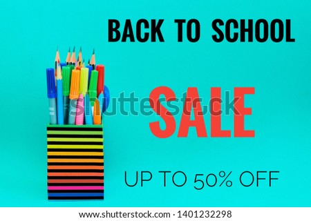 Back to school sale banner with school supplies,50% off on green background