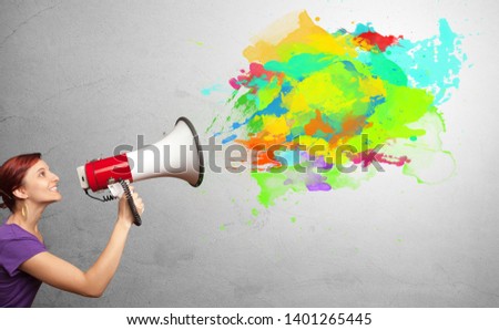 Person with megaphone and colorful splashes