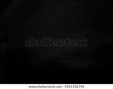 Blurred black mesh surface Suitable for making a background.