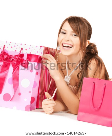 picture of happy girl with colorful gift bags