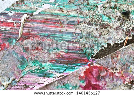 Colorful graffiti paint splashes on the wall and ground at a lost place ruin in Kiel northern germany