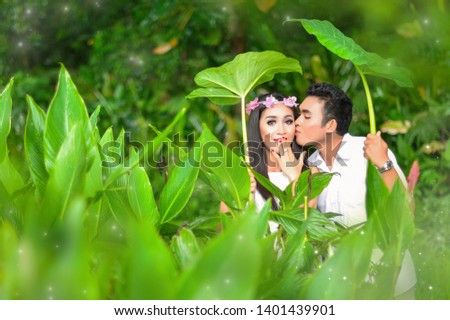 Balinese Couple in Love in Tamblingan Lake, Bali