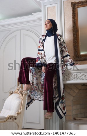 Portraiture of a beautiful female model wearing traditional dress. Eid Ul Fitr fashion.
