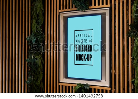 Mock up blank vertical billboard in wooden frame with clipping path on beautiful panel decorated at shopping mall, empty space for insert advertising for information and promotion