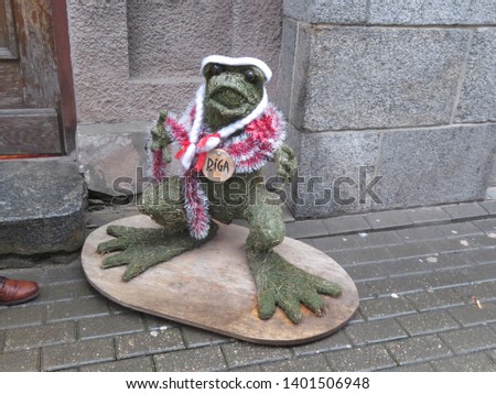 frog figurine on a street in Riga, Latvia