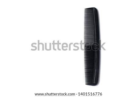 Black barber comb isolated on white background. Barber accessories, copy space