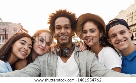 Selfie Time. Multiethnic Teen Friends Photographing Together, smiling at camera, panorama