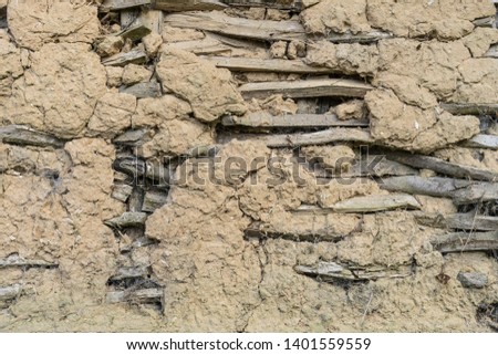 Detail of a weathered clay wall.