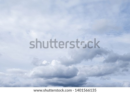 White clouds in the blue sky. Clouds are suspended in the atmosphere condensation of water vapor.