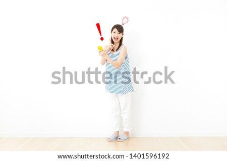 Asian woman smiling in the room