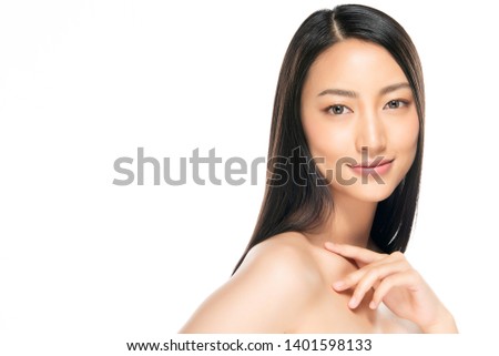 Beautiful Young Woman with Clean Fresh Skin. Face care . Facial treatment . Cosmetology , beauty and spa. Asian women portrait