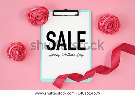 Happy Mother's Day SALE, text on clipboard with res roses and ribbon isolated on pink background
