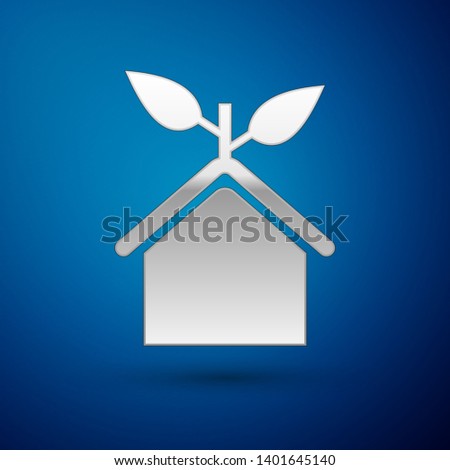 Silver Eco friendly house icon isolated on blue background. Eco house with leaf. Vector Illustration