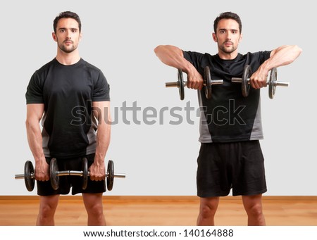 Personal Trainer doing dumbbell upright row for training his deltoids Royalty-Free Stock Photo #140164888