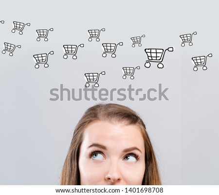 Online shopping with young woman looking upwards
