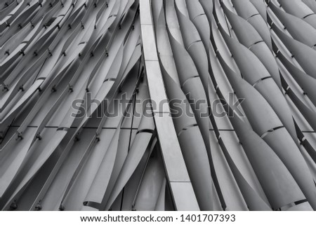 Vertical bend gray aluminium modular facade  with gap in repeat pattern / architectural texture / aluminium facade / background / iron thrones