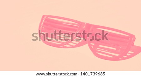 Sunglasses on pink background isolated. Minimal party concept. Summer idea, festive mood