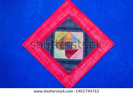 Geometric flat lay blue background, vivid colors of pink and red triangle shapes. Open concept.
