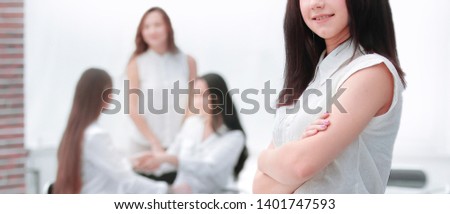 side view. confident young woman on the background of the office