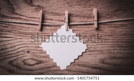 piece of paper with a heart drawn on a clothespin.
