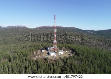 Radio TV Antenna Tower at the top of the Hill. Aerial Landscape of a Nothern Nature. Location Kola Peninsula in Russia near the Kandalaksha Town