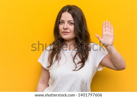 Young curvy plus size woman smiling cheerful showing number five with fingers.
