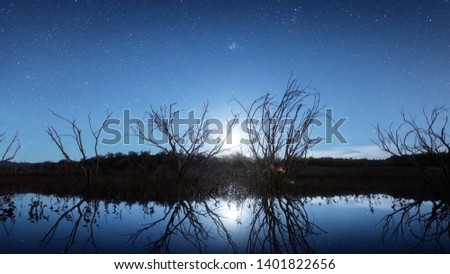 Photo of the river and the starry sky at sunrise