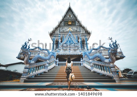 Asian traveller woman travel in Wat Pak Nam Khaem Nu temple, Chanthaburi, Thailand Royalty-Free Stock Photo #1401849698