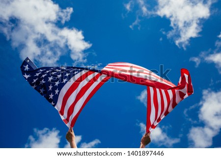  4th of July - Independence day. - American flag blown in the wind. 