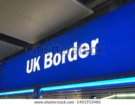 UK border sign white letters on blue